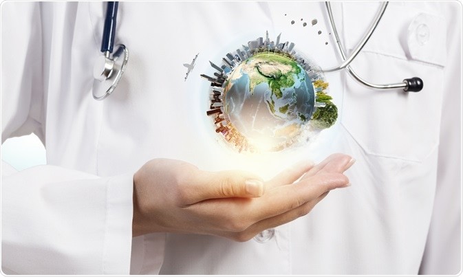 Woman doctor with globe in her hand offering medical tourism