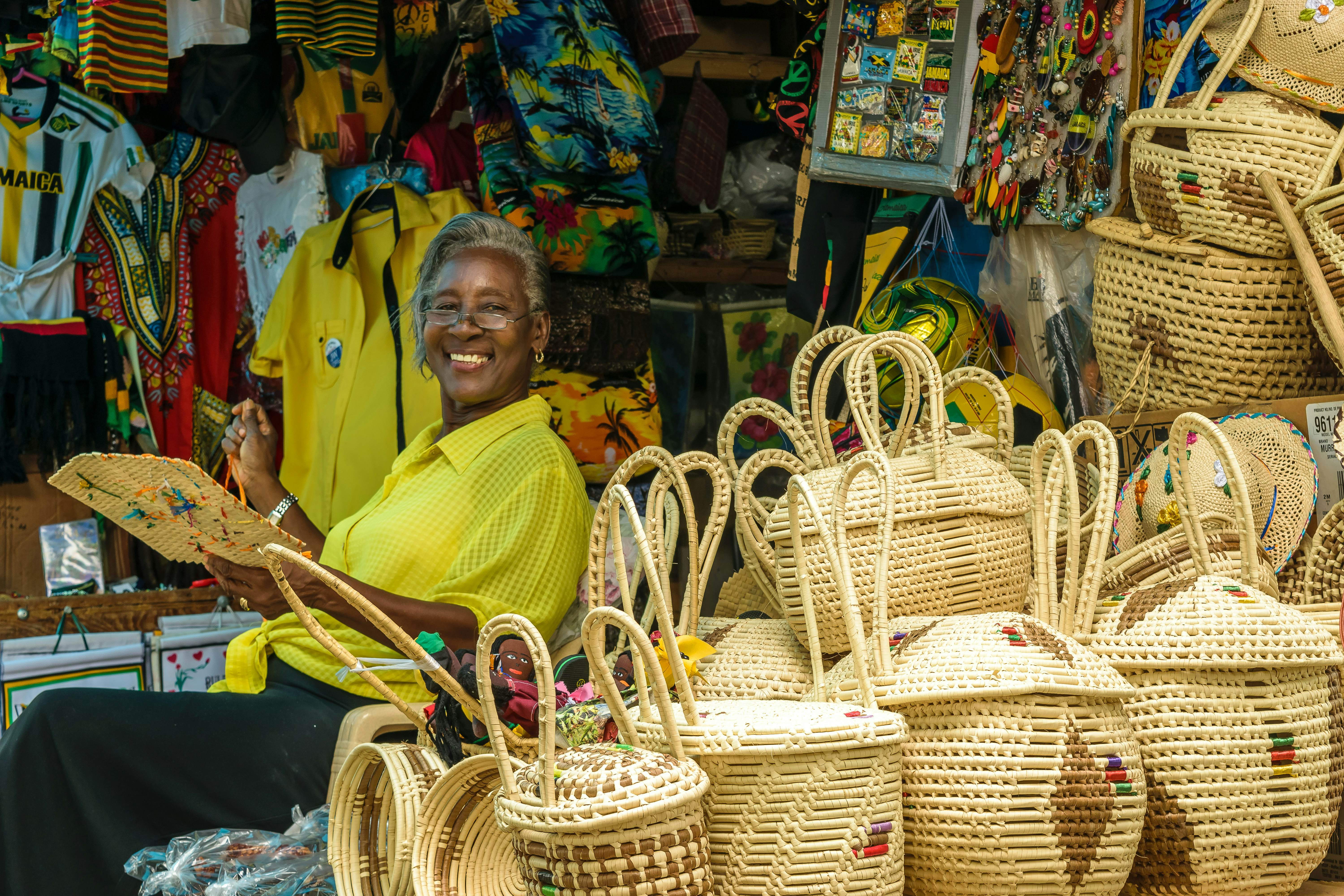 Woman weaving at a vendor stall in Jamaica