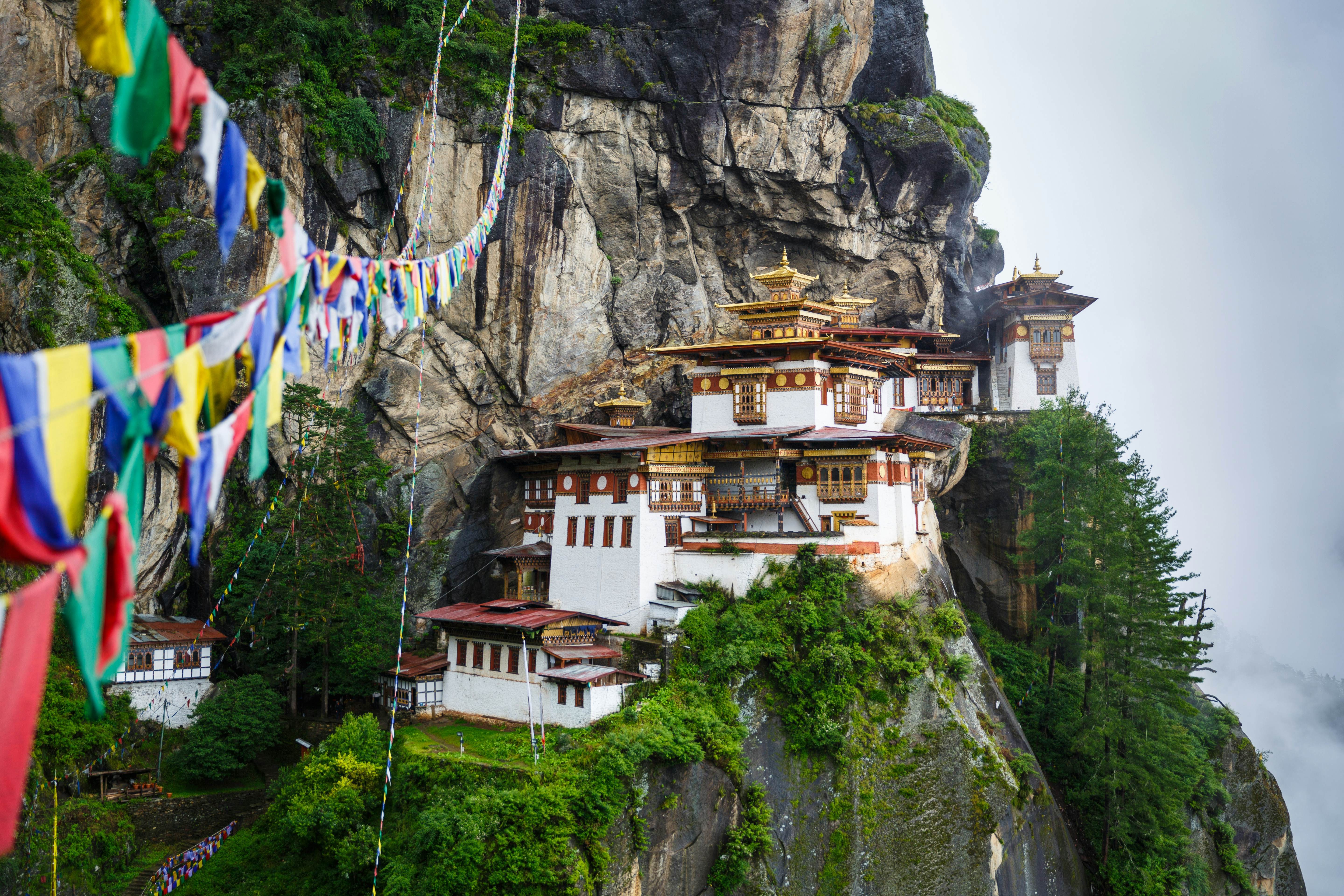 The Taktshang (Tiger’s Nest) Monastery, near Paro, Bhutan, clings to the side of a sheer rock face.