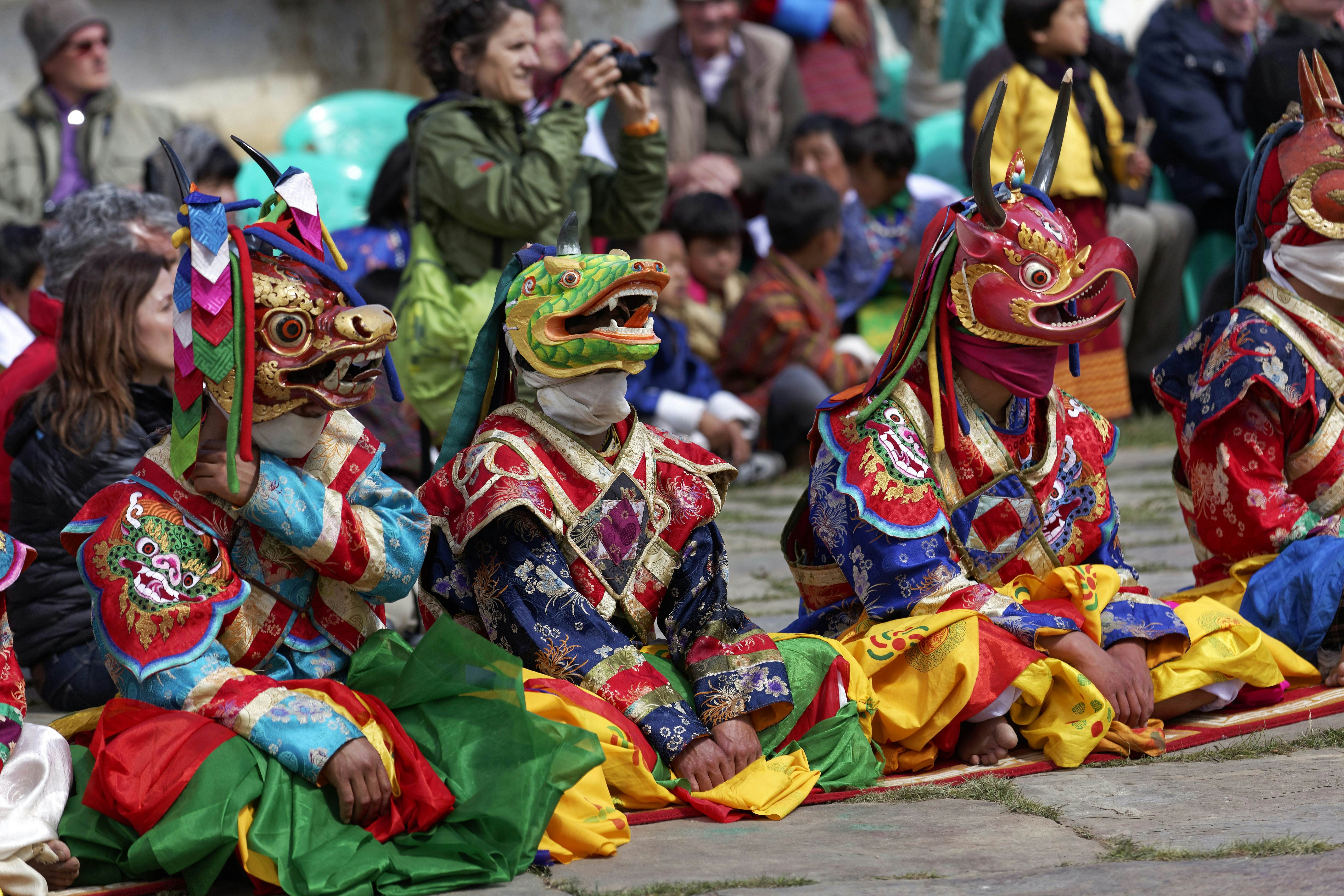 Masked dancers at a Buddhist festival in Bumthang, Bhutan.