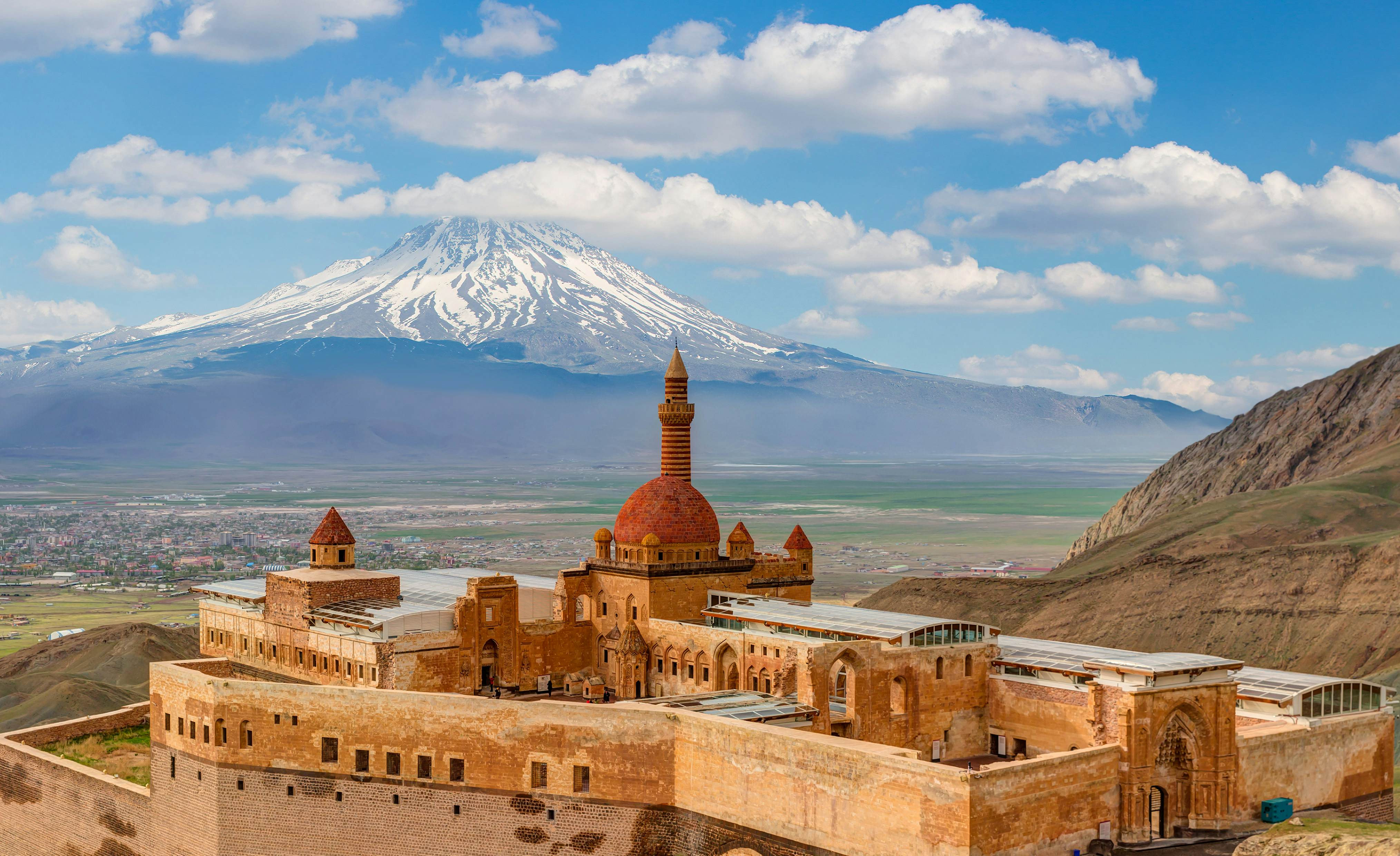 A red-stone palace with a central domed tower. in Turkey