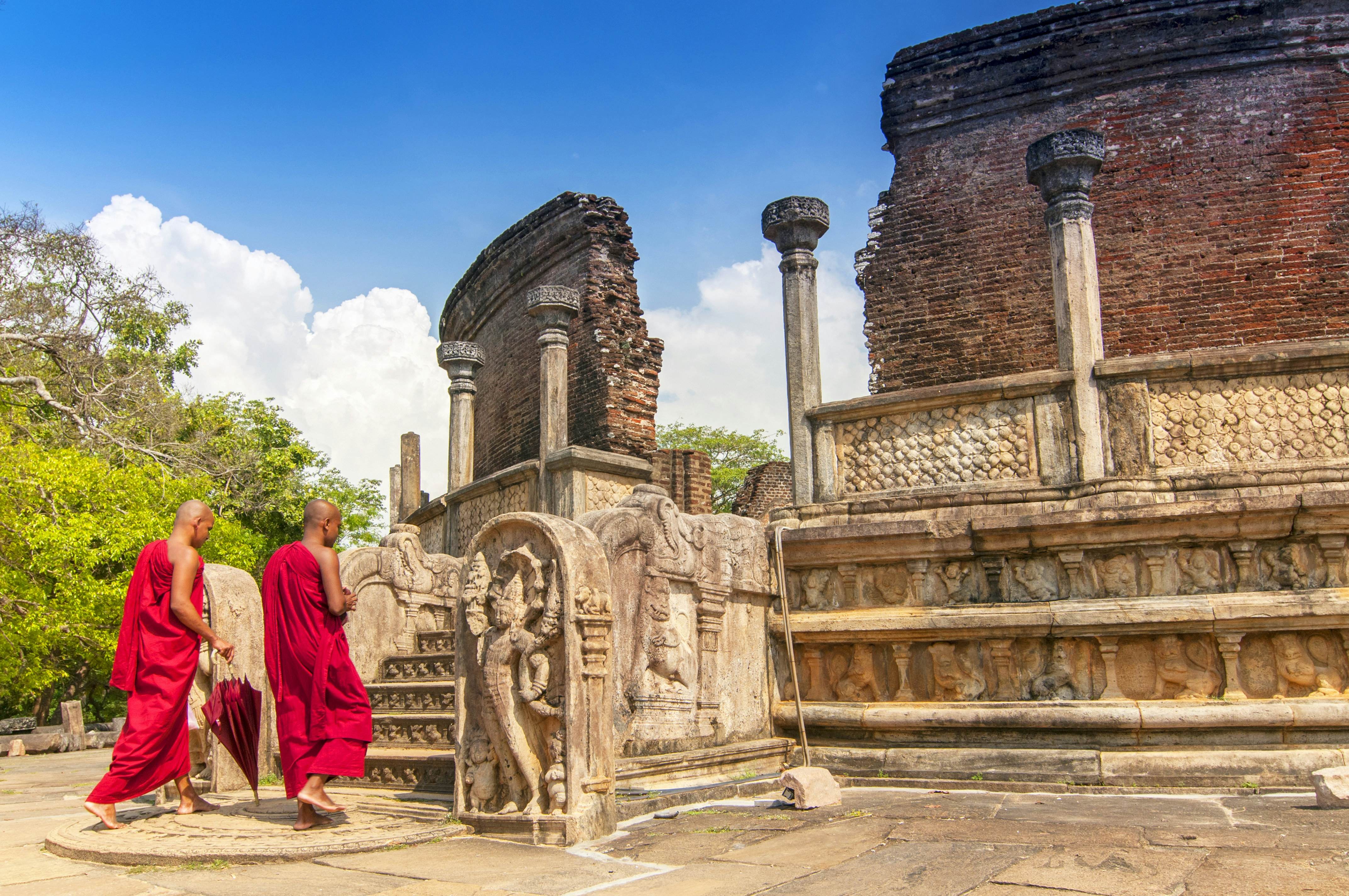 Monks in Sri Lanka walking into a temple