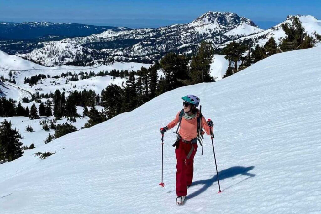 A backcountry skier ascends Mount Lassen in Northern California, covered in snow