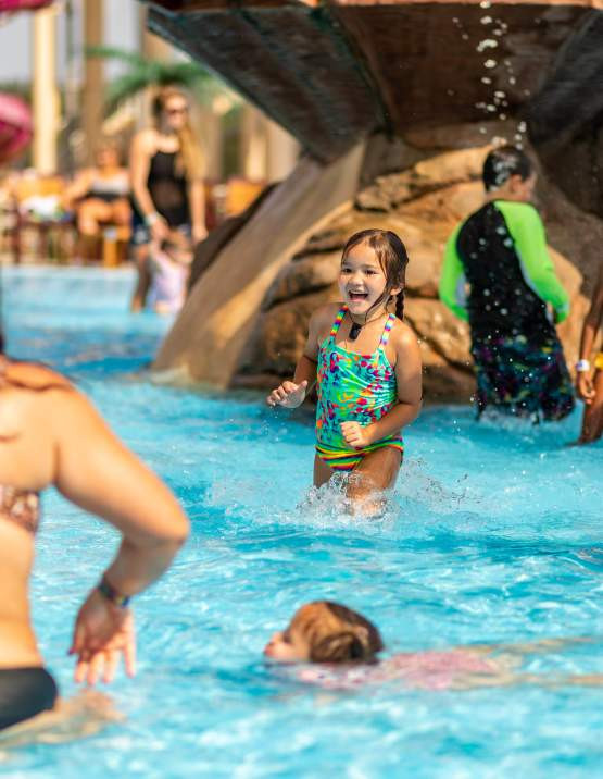 Family enjoying the pools at Parrot Island Waterpark.