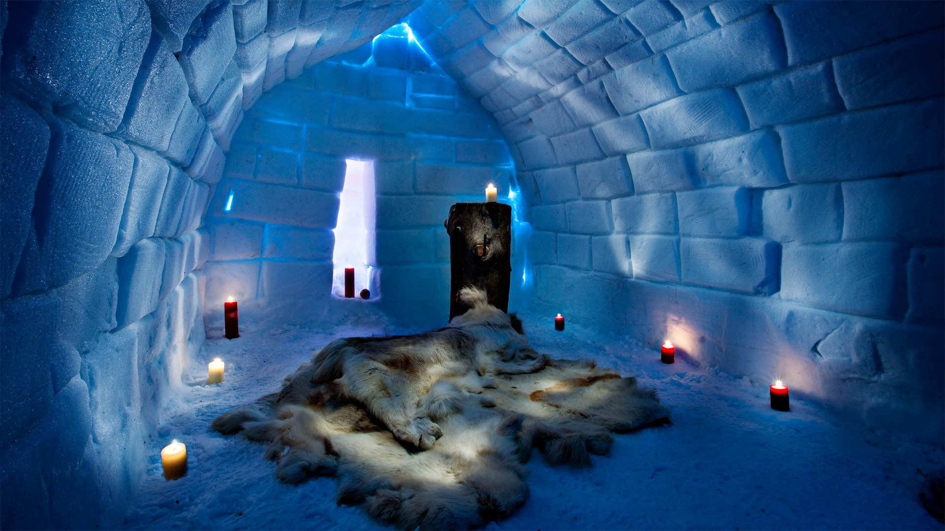 Arctic SnowHotel in Rovaniemi, Finnish Lapland. An ice hotel room with intricate carvings on the snowy walls