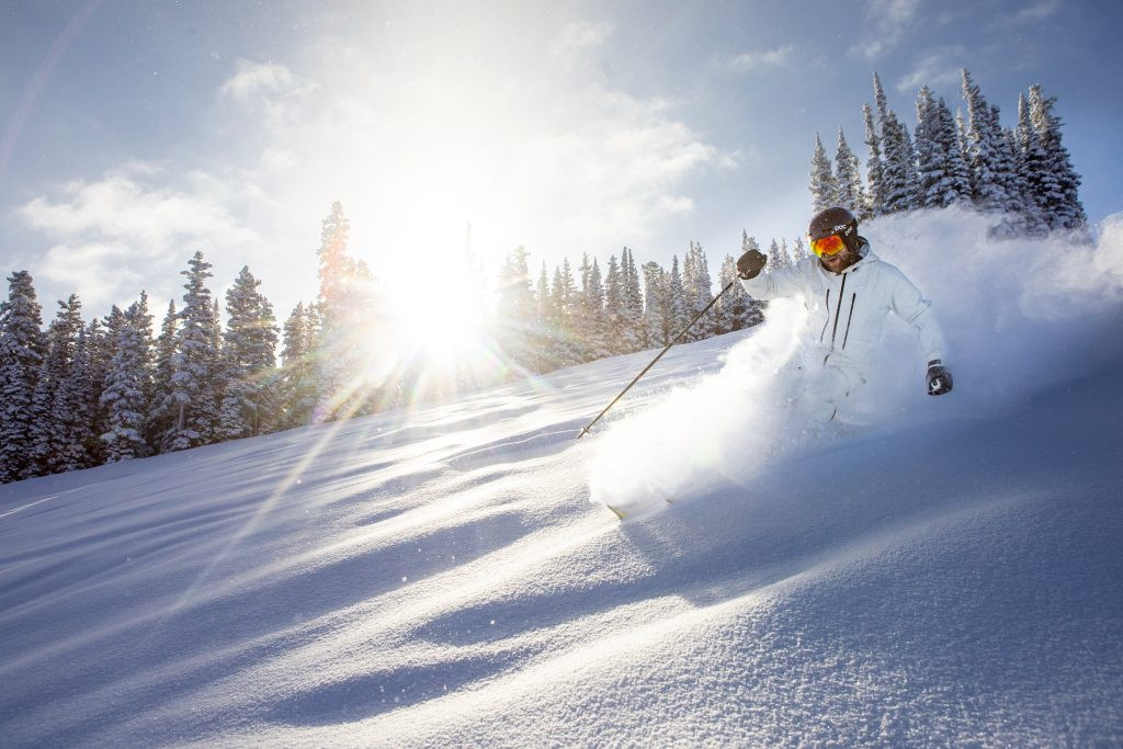 Snowmass Village nestled in the Colorado Rocky Mountains, promoting community-focused tourism and sustainable practices.