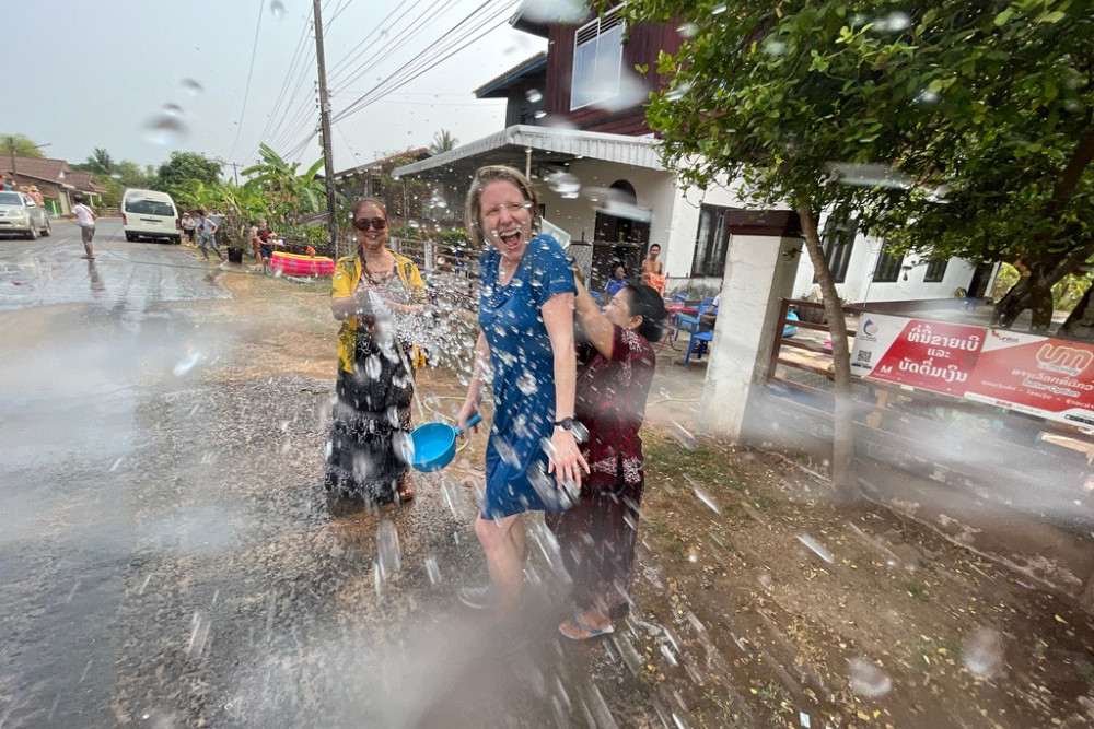 Brook getting water-splashed by a local during Songkran Water Festival