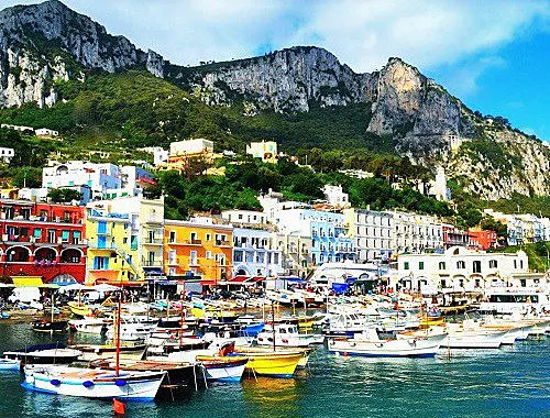 Charming harbor in Southern Italy with colorful buildings and boats
