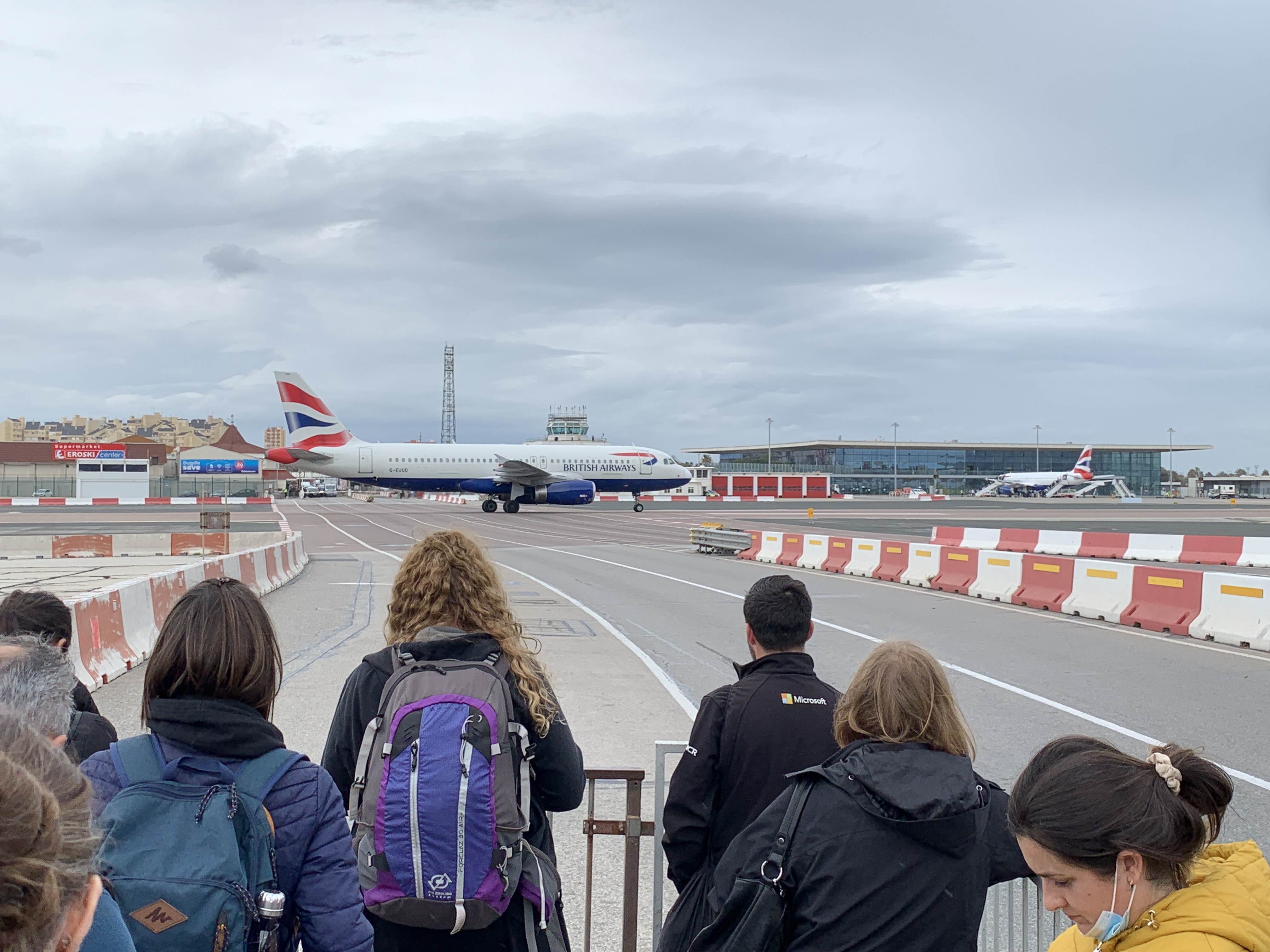 Walking across the Gibraltar Airport runway