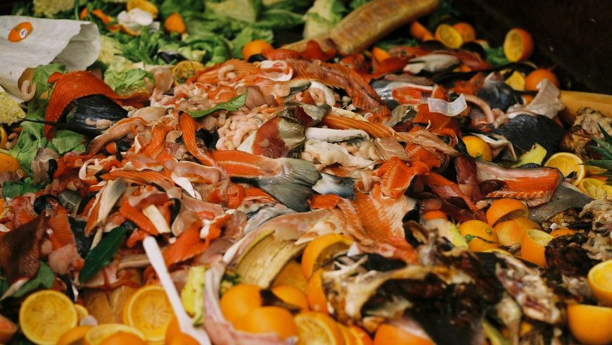 A buffet table overflowing with food, illustrating the potential for food waste in the tourism industry