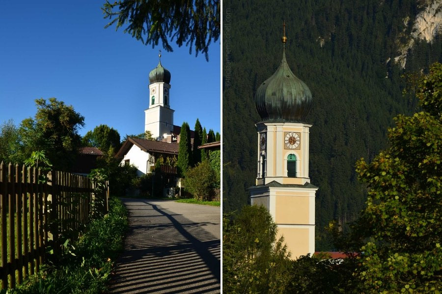 A pale yellow church, with a copper dome resembling an onion, in the German town of Oberammergau.