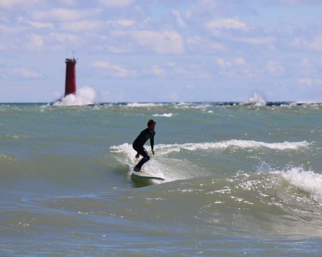 Surfers catching waves on Lake Michigan in Sheboygan