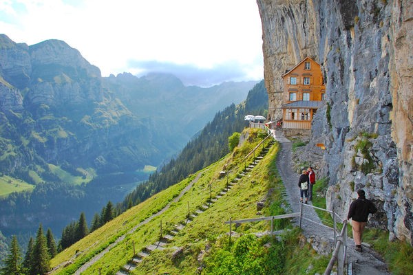 Berggasthaus Aescher clinging to a cliff in Appenzell, Switzerland