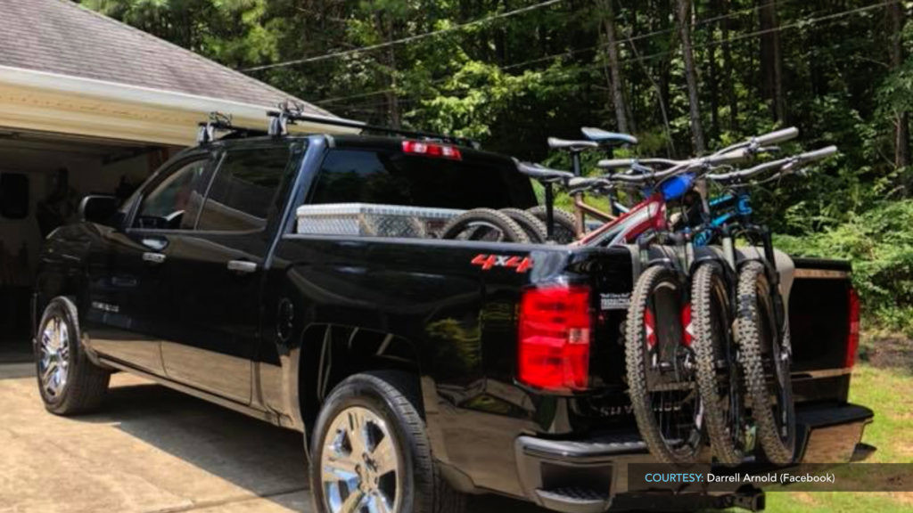 A tailgate mat being used to carry bikes in the bed of a truck, offering a simple solution for bike transport