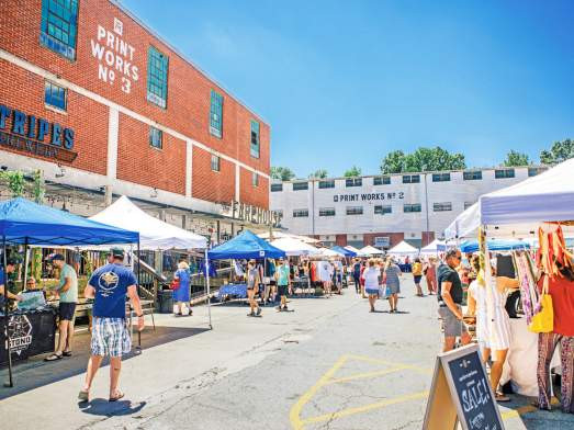 People shopping at Taylors Mill, enhancing Greenville's vibrant community experience