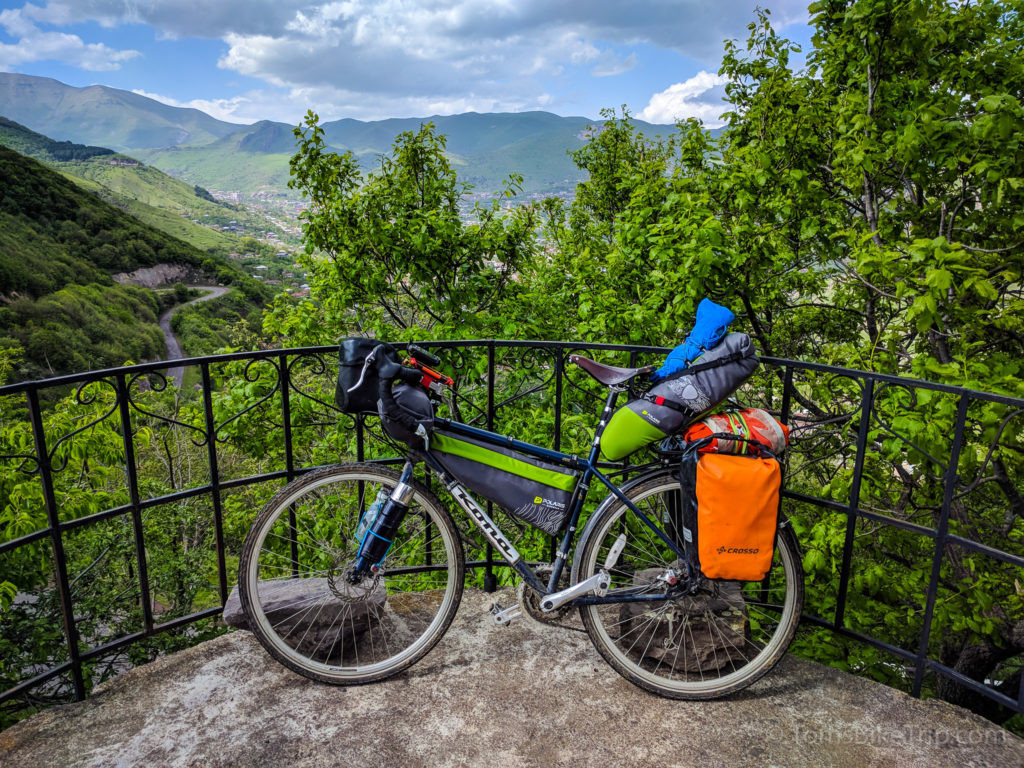 A Kona Sutra 2012 touring bike with a lightweight frame luggage and pannier setup.