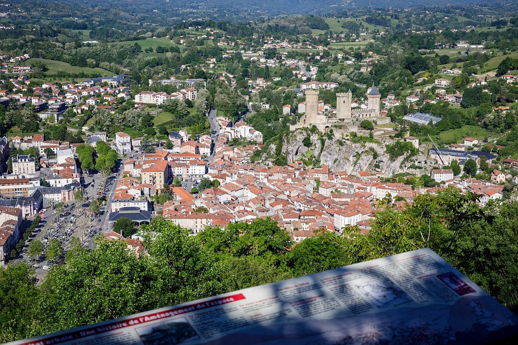 Foix Castle perched atop a rocky promontory, showcasing its medieval architecture and strategic location