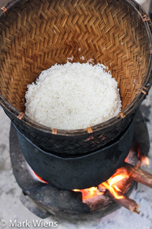 Steaming sticky rice in a bamboo basket