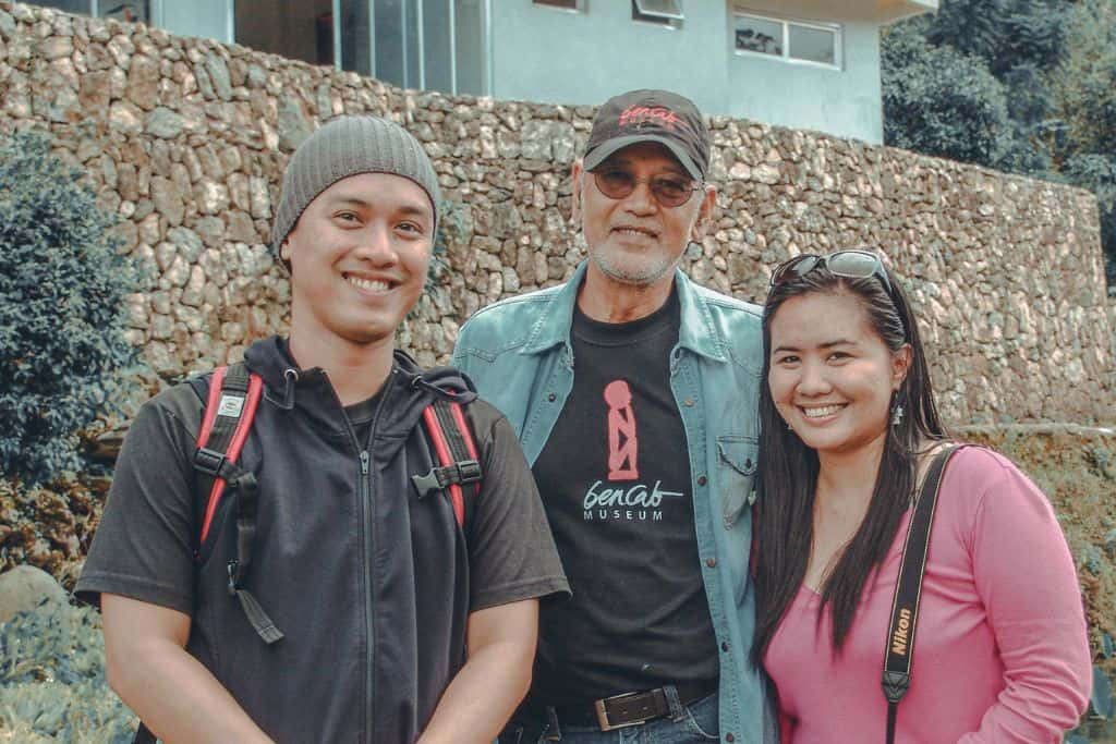 Traveler posing with Philippine National Artist BenCab at the BenCab Museum, surrounded by contemporary art