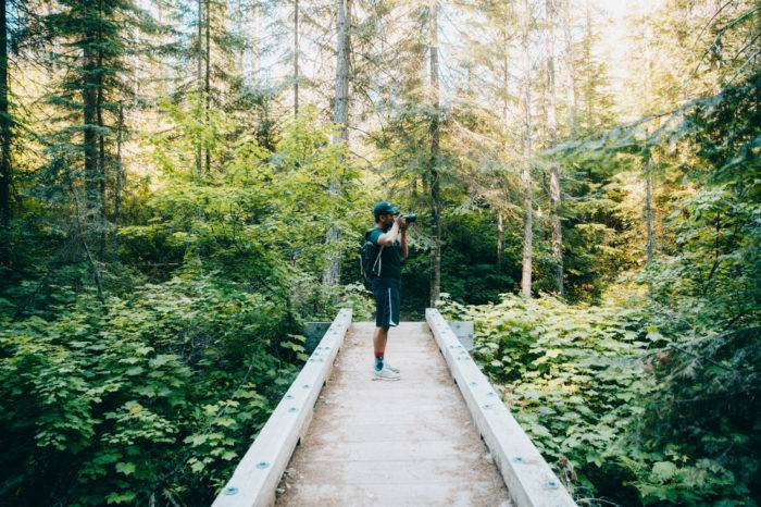 Man on bridge along the Pulaski Tunnel Trail, Northern Idaho.