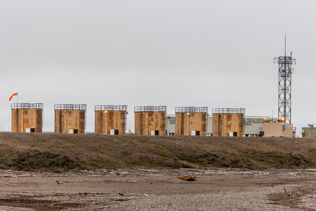 Industrial buildings at Arctic Ocean, Prudhoe Bay, with a gray sky highlighting the stark Arctic landscape