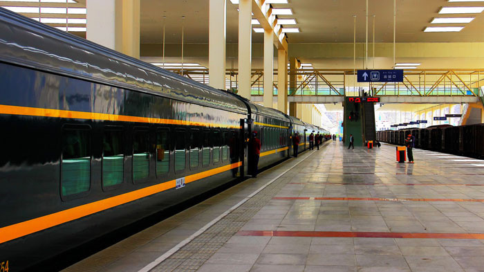 The Tibet Train winding through the scenic landscapes, offering a unique travel experience to Lhasa
