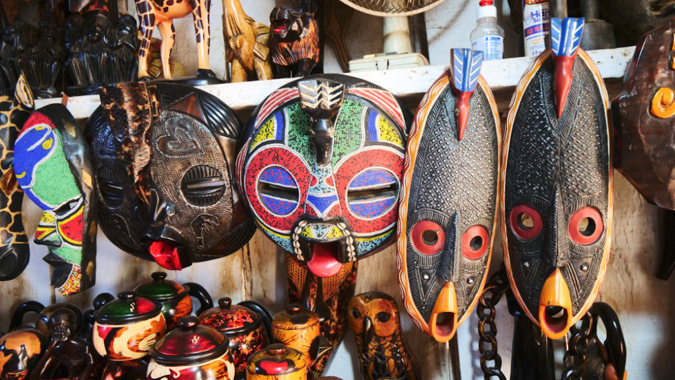 Artisans crafting wooden sculptures in Ahwiaa