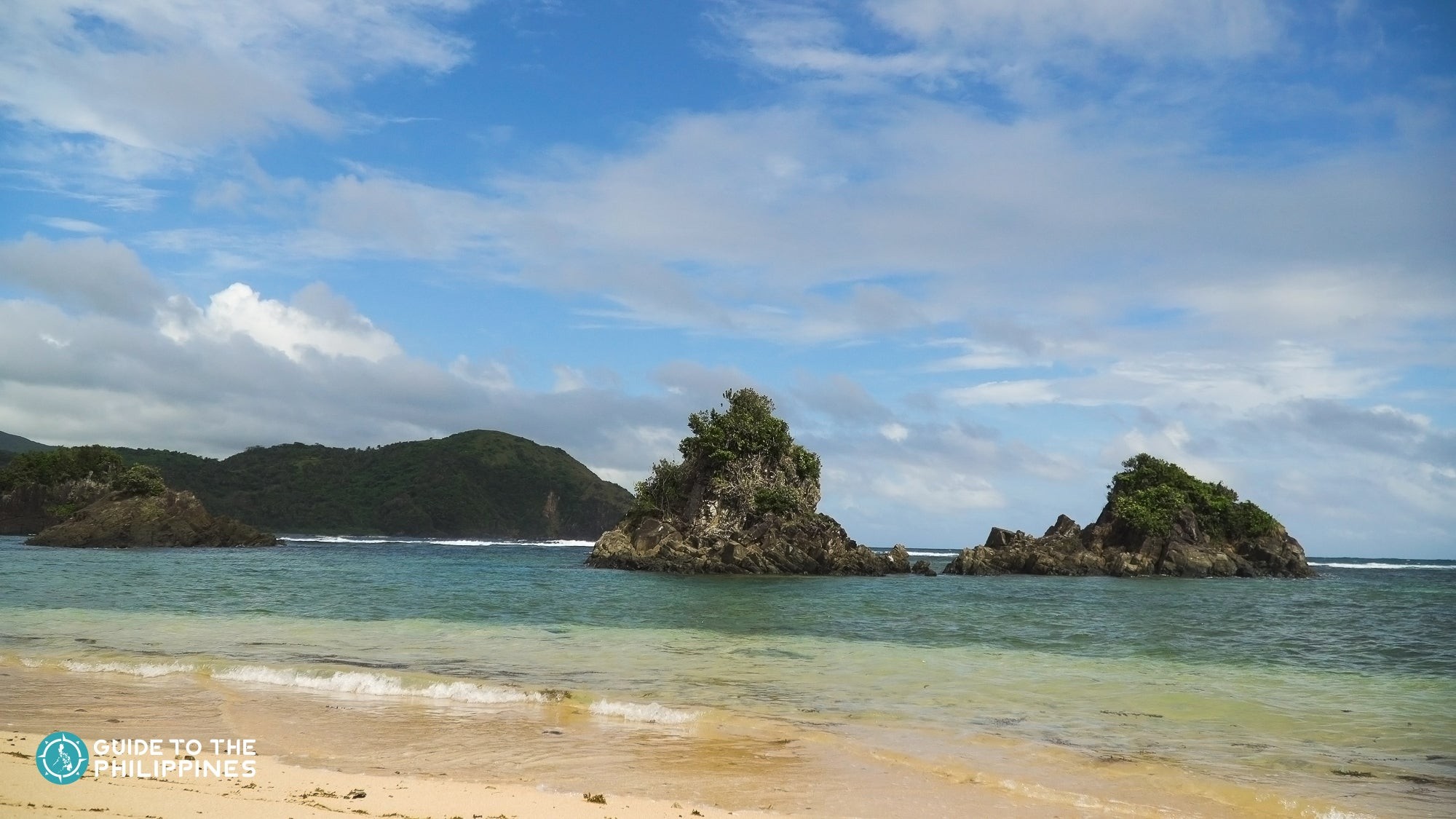 Pristine white sand and clear blue waters of Marilima Beach in Catanduanes