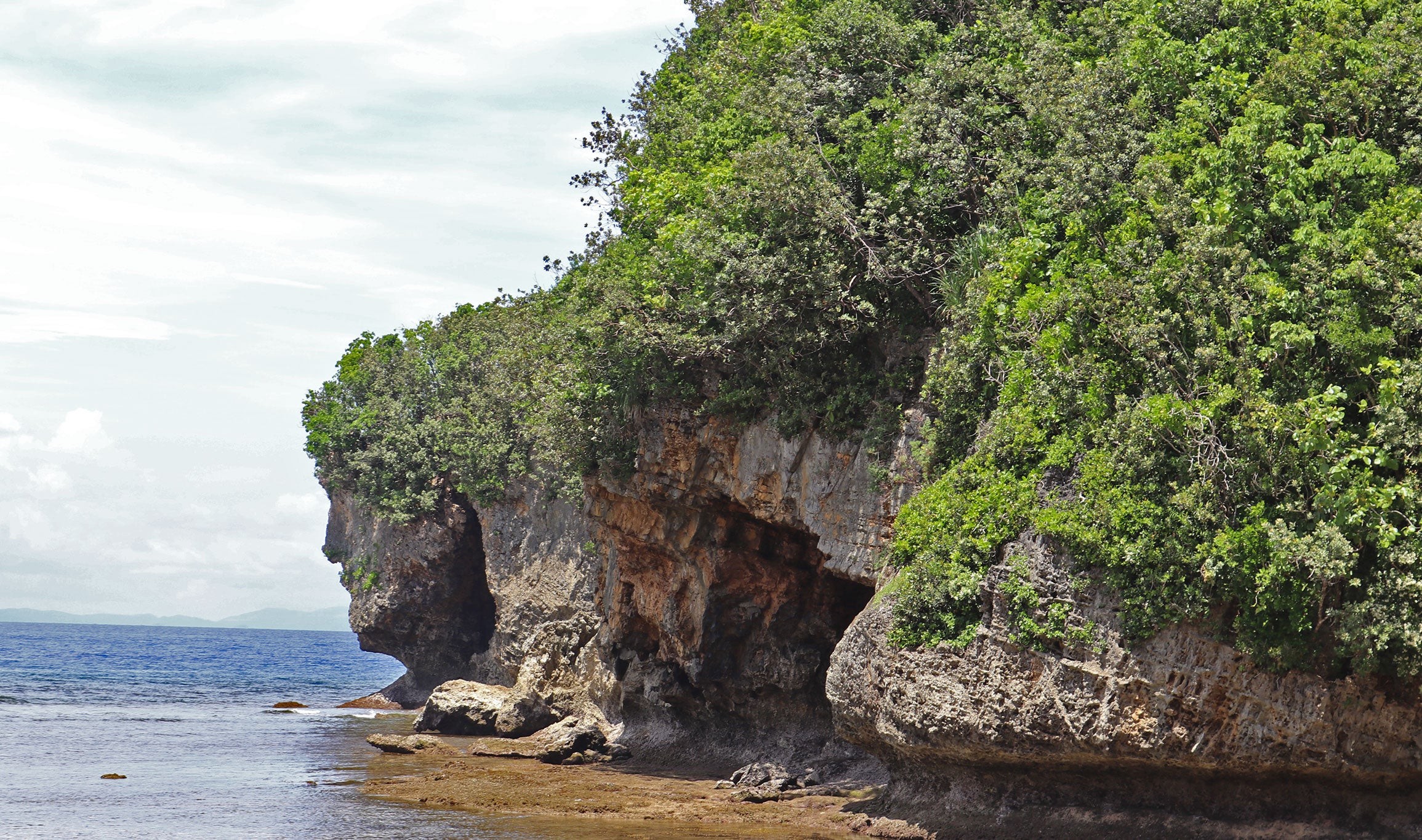 Unique rock formation resembling Jesus' face at Talisoy Beach in Catanduanes