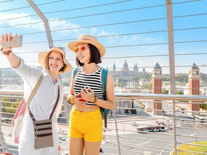 Tourists taking a selfie at the Plaça d