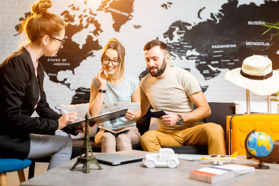 Couple discussing travel plans with a travel agent