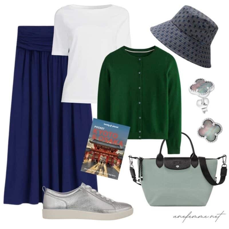 Travel outfit idea with jersey skirt, white tee, green cashmere cardigan, denim bucket hat, Longchamp pliage bag.
