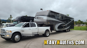 Travel trailer being transported on a flatbed truck