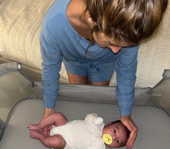 Baby Safely Sleeping in a Travel Bassinet