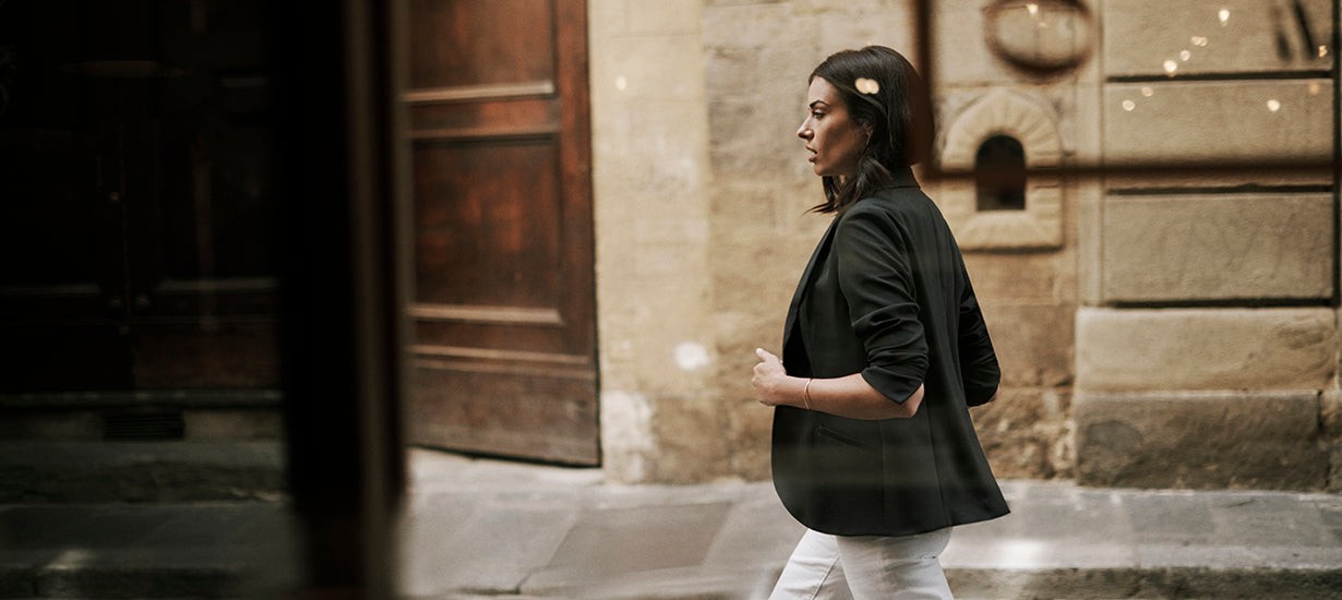 Woman wearing travel blazer in Italy