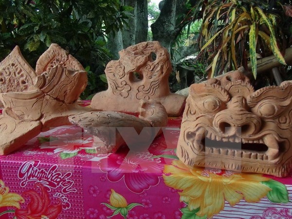 Stone tools unearthed at an archaeological dig site in Vietnam, showcasing prehistoric craftsmanship and ingenuity