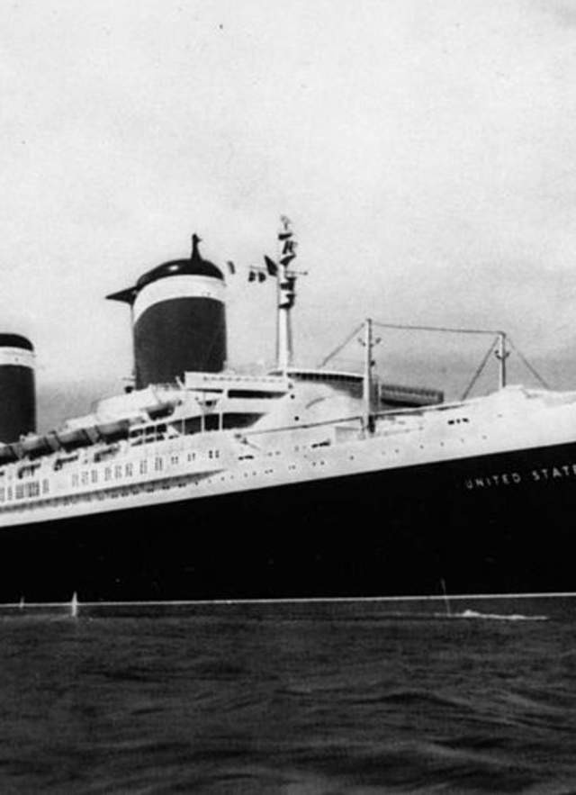 A majestic SS United States ship sailing at sea in its prime, likely around mid-1950s