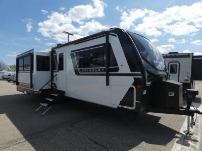 Interior of a Brinkley Model Z Air travel trailer showcasing the kitchen island