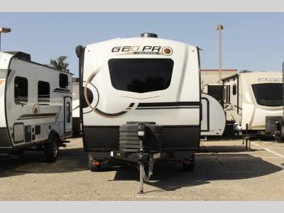 Used Travel Trailer on a campsite