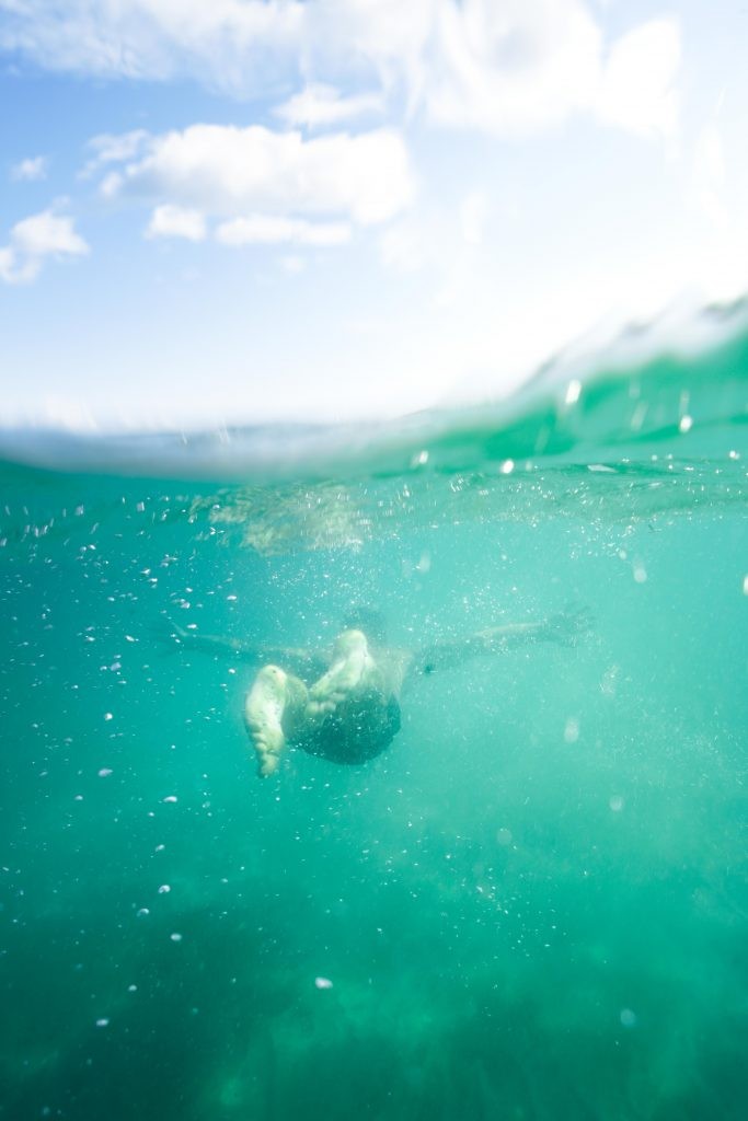 A friendly wave exchanged between two cars on a Beaver Island road