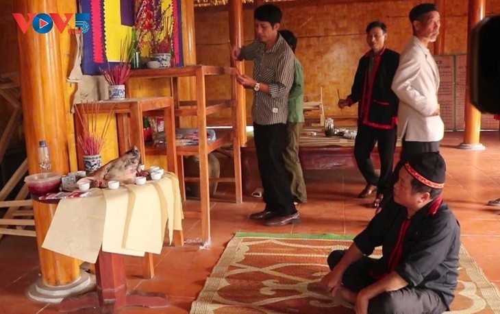 Pa Then family members come together in prayer, hoping for a new year filled with peace and a plentiful harvest