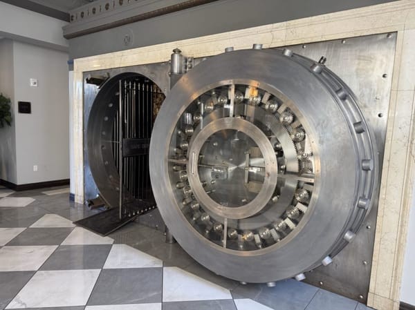 The original 16-ton bank vault door now serves as the entrance to The Treasury Bar