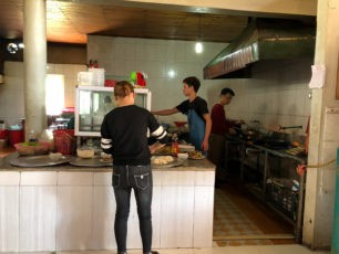 Savvy travelers enjoying street food in Vietnam