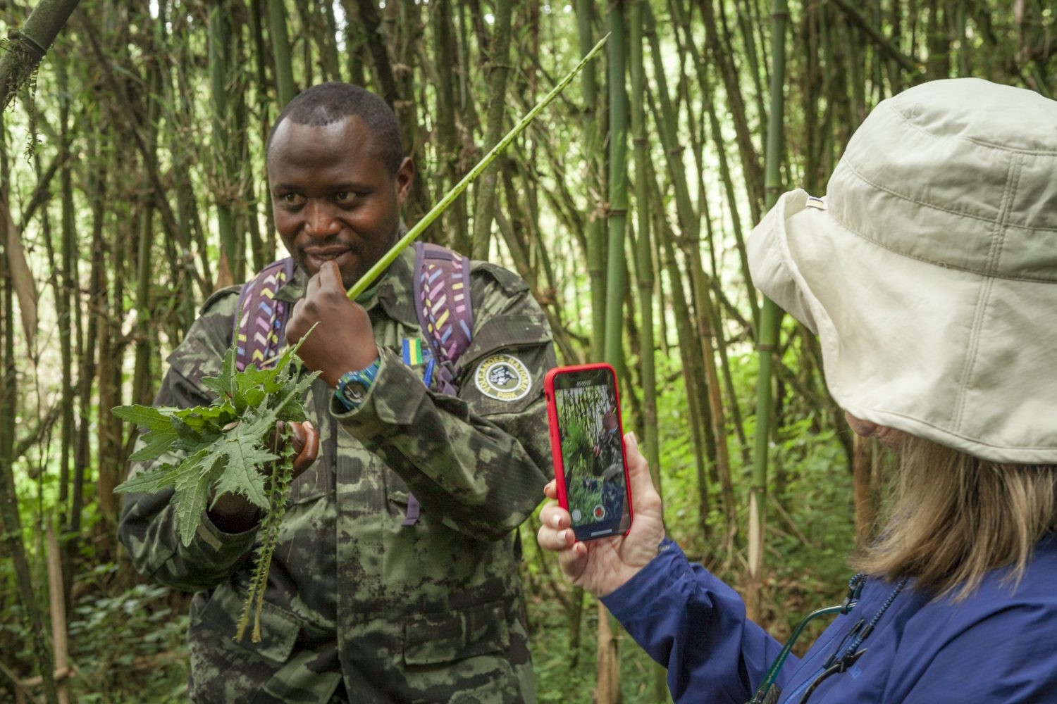 A park ranger explaining rules to tourists before gorilla tracking