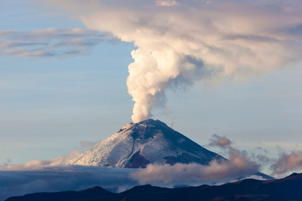 Cotopaxi volcano from Quito, Ecuador, displaying its perfectly shaped snow-capped peak and offering opportunities for hiking and climbing for Quito tourism