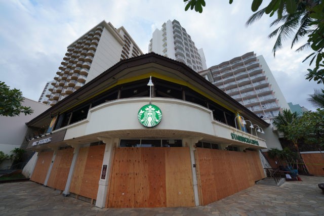 Waikiki Starbucks Coffee near the Kapahulu Avenue is is boarded up during Coronavirus COVID-19 pandemic. April 15, 2020.