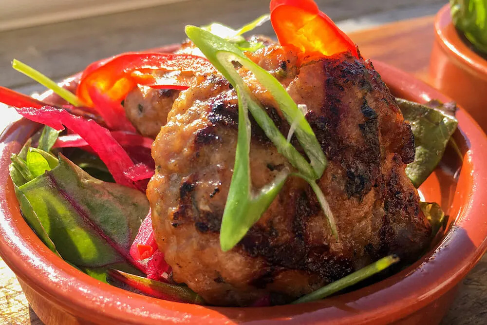 Enjoy grilled Thai pork putty in Derry, a testament to the city's diverse and delicious culinary offerings.