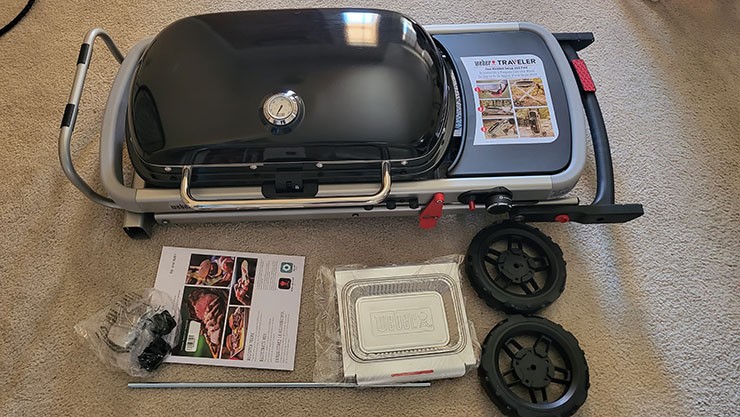 Weber Traveler Portable Gas Grill Unassembled on the Floor