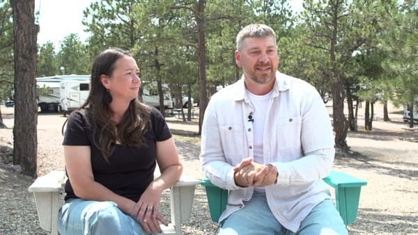 Nicole Weiss and her husband, Thad Weiss, sit at the firepit at the KOA Campground they run in Hot Springs, S.D
