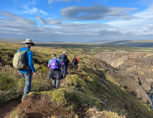 People hiking through Iceland's diverse landscapes